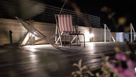 evening relaxing chairs setup with ambient lights on terrace,slider shot