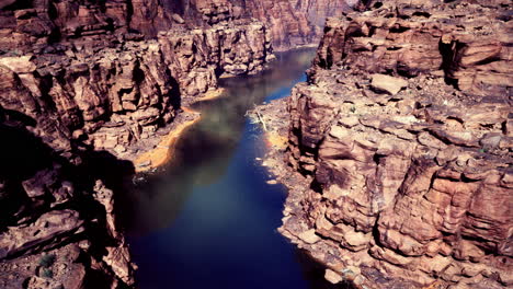 vast canyon landscape features a winding river nestled between rocky cliffs