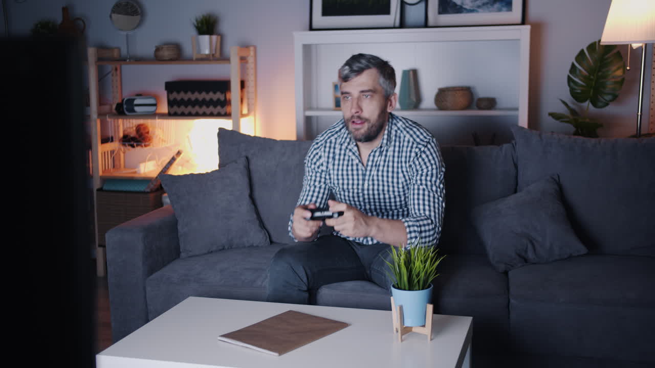 Man Playing Video Games at Home