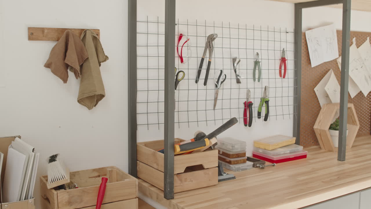 A workbench with organized tools and office supplies