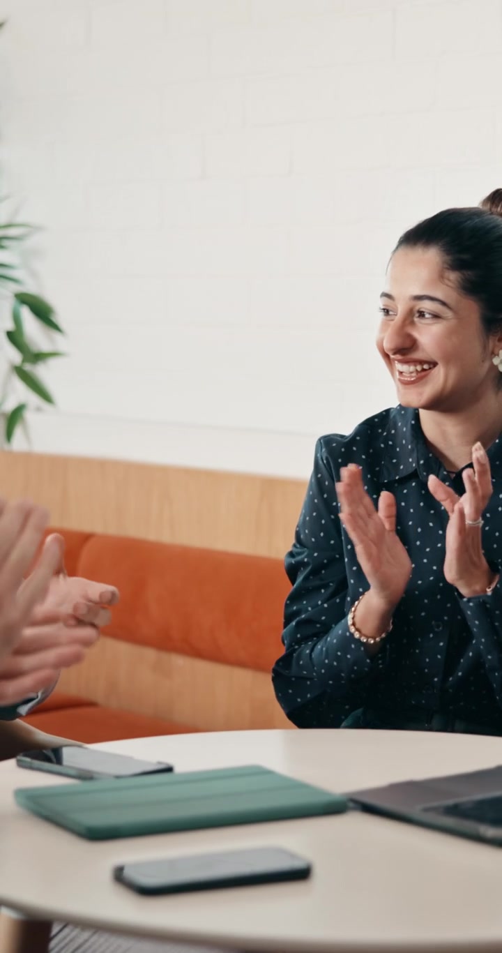 Diverse Business Team Celebrating Success with High Five in Office