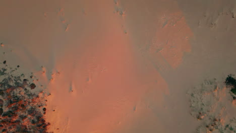 aerial view sunset dunes in wilderness. tranquil desert landscape on golden hour