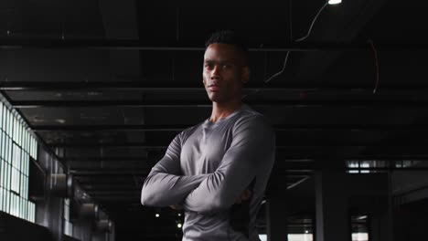 Portrait-of-african-american-man-crossing-his-arms-and-looking-at-the-camera