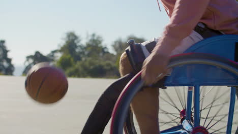 closeup shot of man riding in sports wheelchair