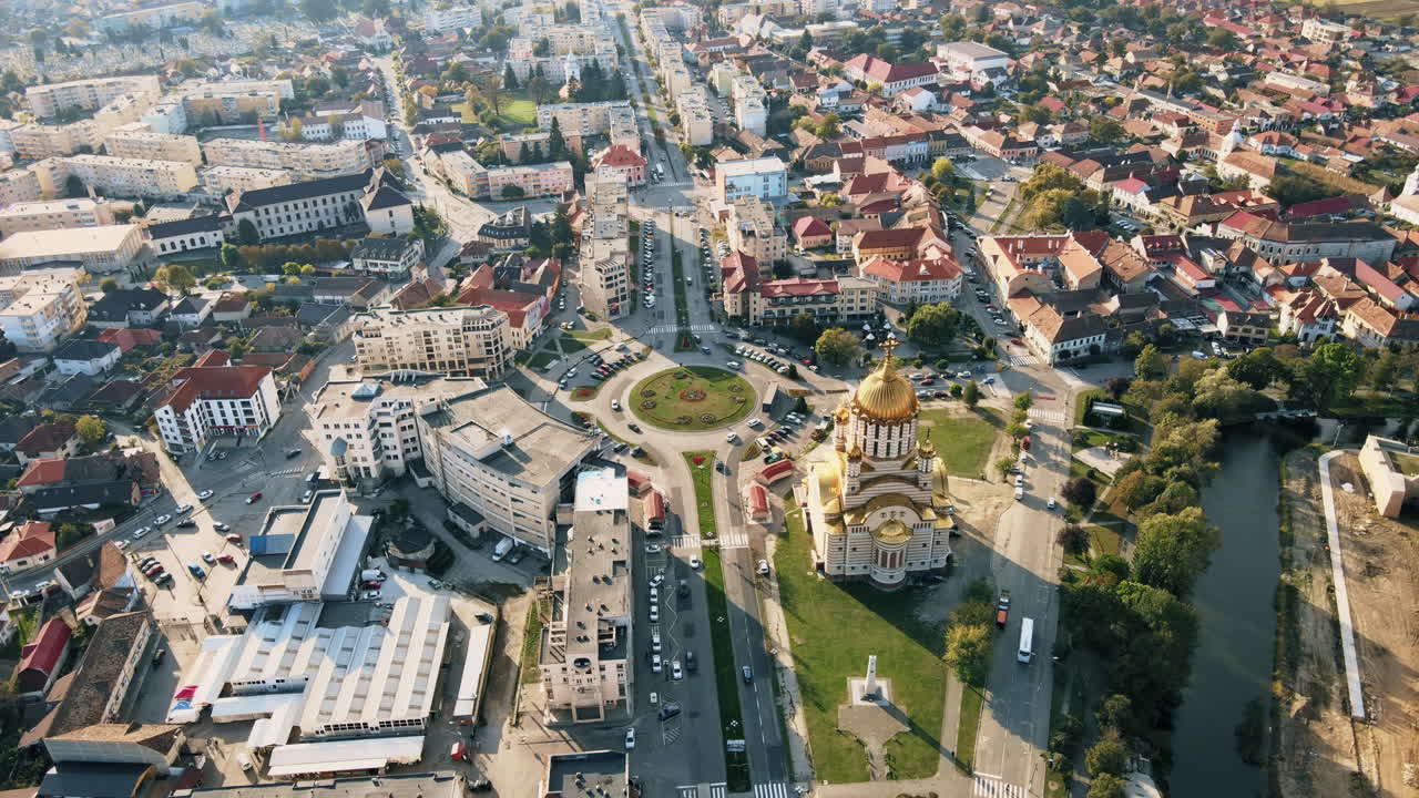 Aerial drone view of the Fagaras, Romania. Church of the Saint John the Baptist, multiple buildings, roads