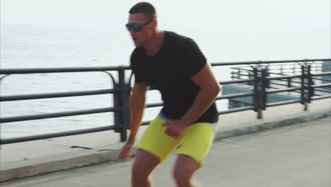 man rollerblading on a city pathway by the river