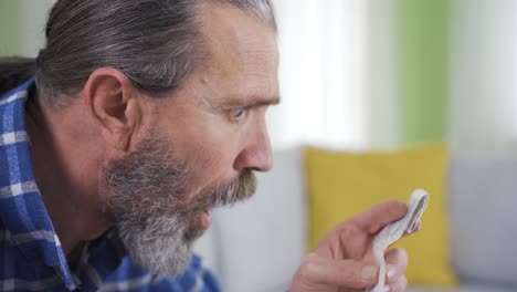 confused old man looking at overpriced bill.