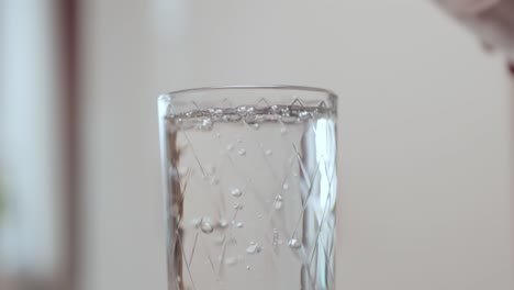 clean drinking water poured into a glass.