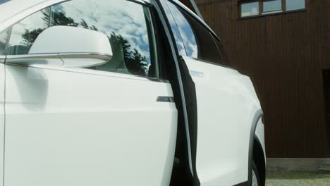 white tesla model x with child car seat