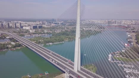 Slow-ascending-tilting-shot-of-Ada-bridge-in-Belgrade,-Most-na-Adi-Beograd