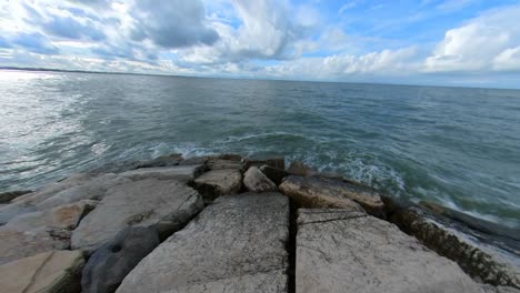 breakwater pier stone with hole in rimini, italy
