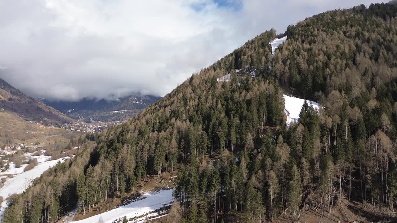 There are winter sports that play the role of the Winter Olympics in Cortina and Milano Italy. Learning to ski and snowboard I capture these videos with my drone that is in a ski resort. white mountai