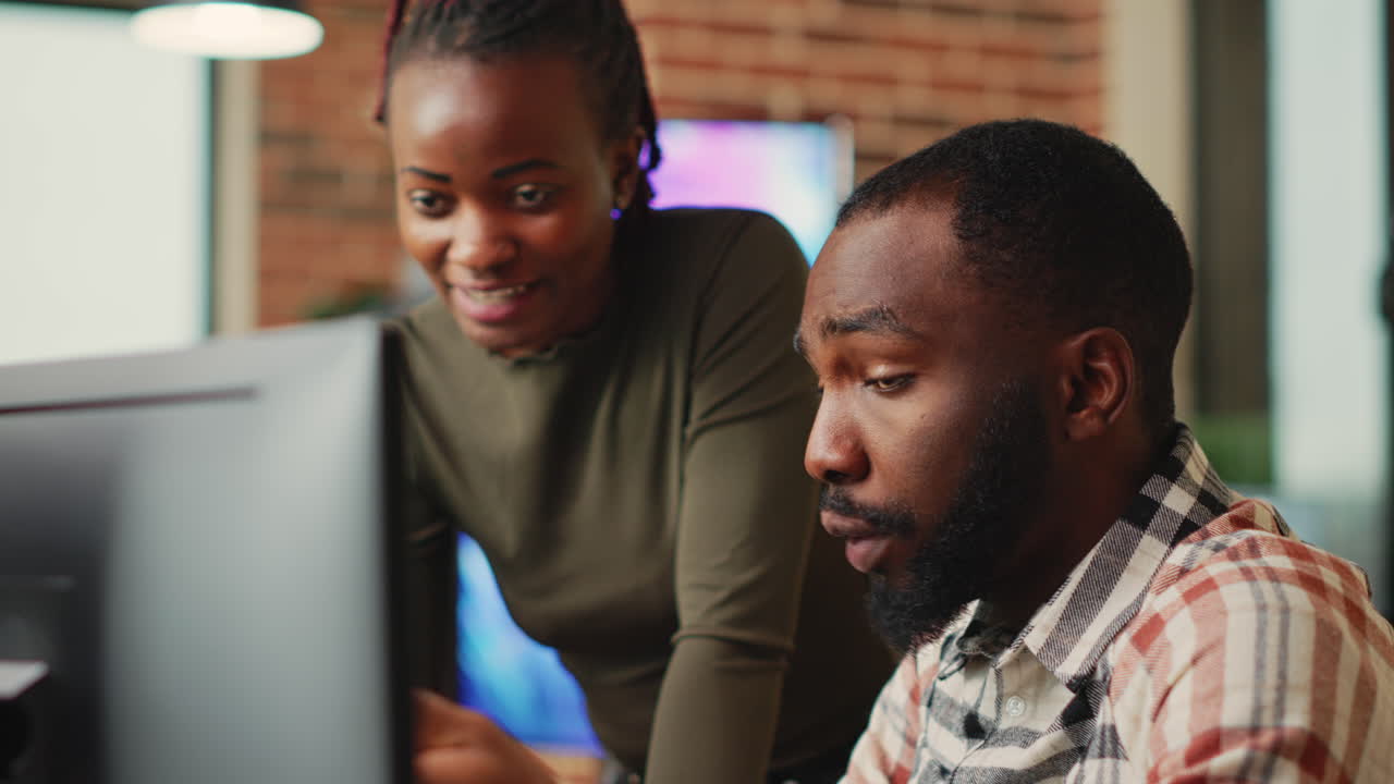 African american team of engineers working with 3d modelling software