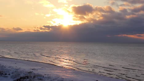 Colorful-Winter-Sunset-on-the-Shore-of-the-Gulf-of-Riga-in-Latvia-Saulkrasti-White-Dune