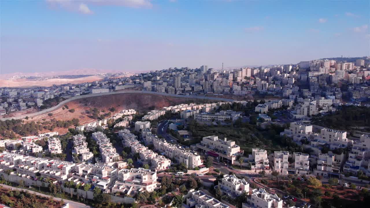 Aerial View of Urban Settlement and Security Barrier