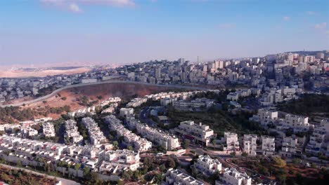 aerial view of urban settlement and security barrier