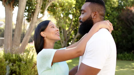 enjoying quality time together, couple embracing outdoors in park