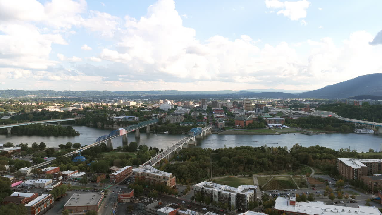 Drone view of Chattanooga’s skyline framed by the Tennessee River and Lookout Mountain, capturing the blend of city life and surrounding nature