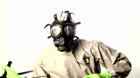 a man in a hazmat suit speaks into a walkietalkie 1