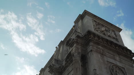 arch of constantine, medium shot, pivoting from below at a low angle