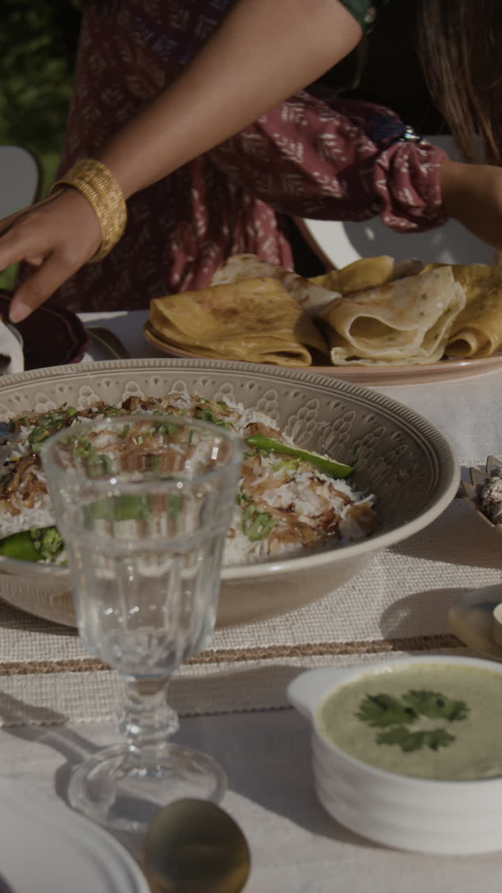 Outdoor Dining with a Variety of Dishes, Including Rice and Pancakes