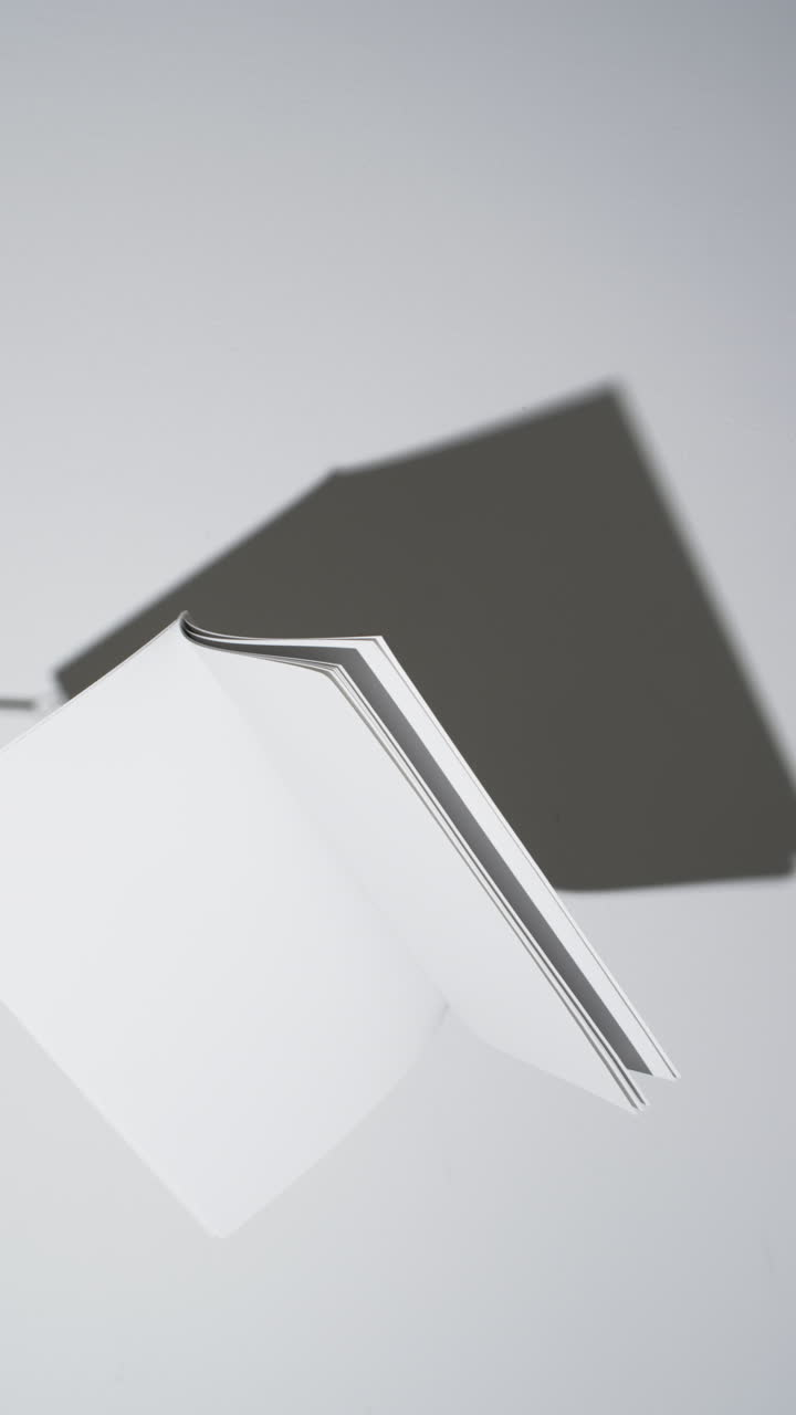 Vertical video of book with blank pages and copy space on white background