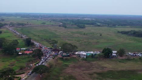 traffic congestion: vehicles entering elorza fair in rural apure