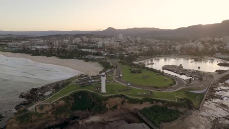 aerial view of wollongong, new south wales, australia, showcasing the coastline, cityscape, and surrounding landscapes during a bright afternoon