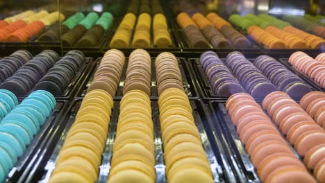 colourful window display or rows of sweet candy macaroons through store window