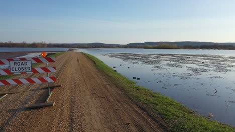 flooded road and wildlife in a scenic river valley