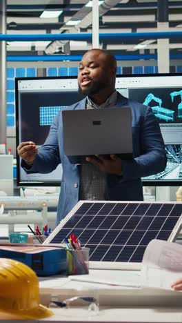 vertical video teamworking factory colleagues researching new photovoltaics materials