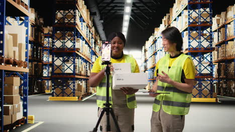vertical video multiethnic employees promoting the merchandise in boxes on a video