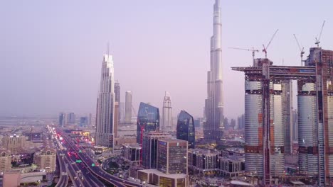 dubai skyline at dusk with construction