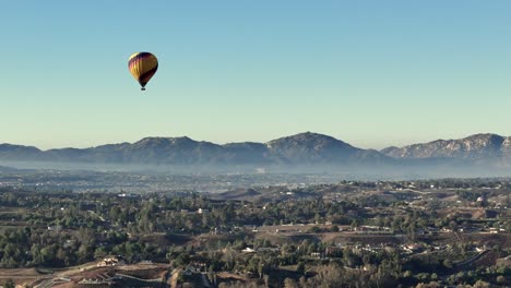 temecula hot air balloon drone parallax shot moving to the right minimal cloud cover over wineries