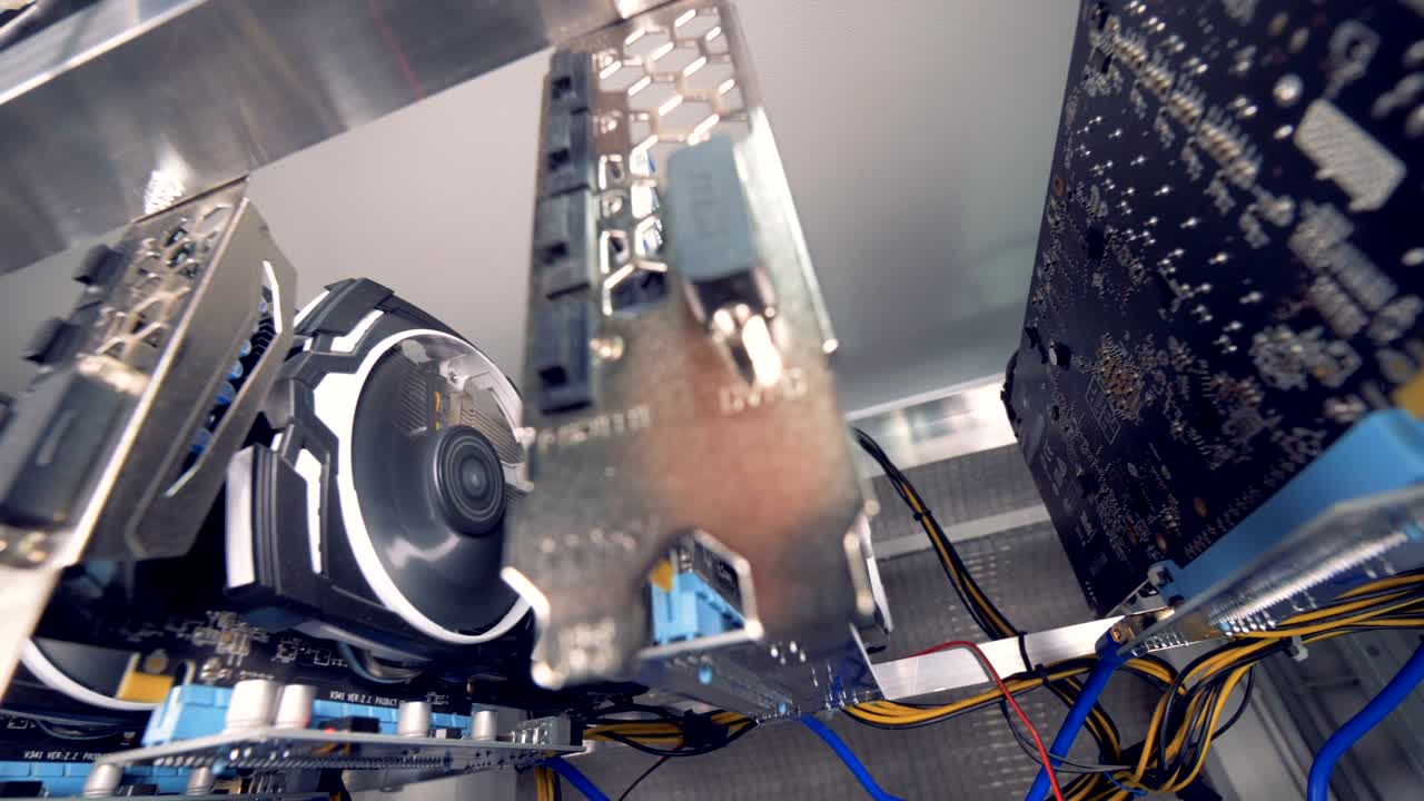 Row of bitcoin miners. Mining farm with lots of videocards.