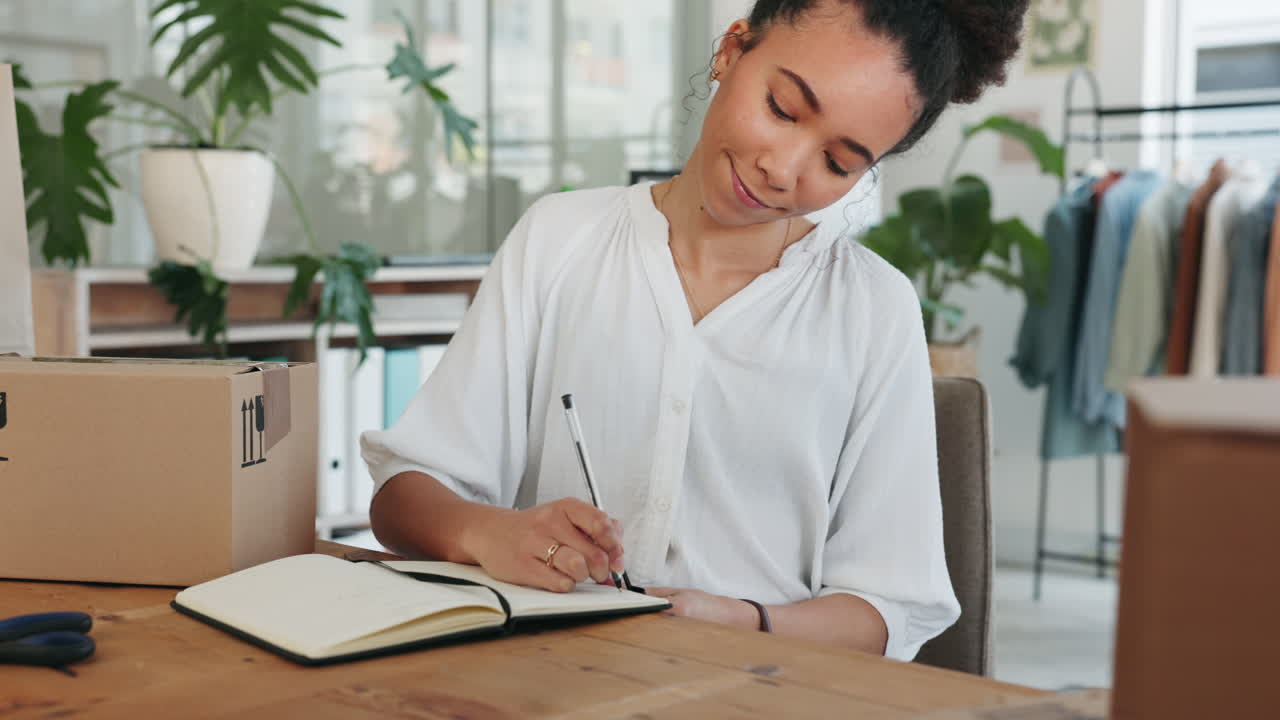 Black woman, writing in notebook