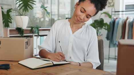 Black-woman,-writing-in-notebook