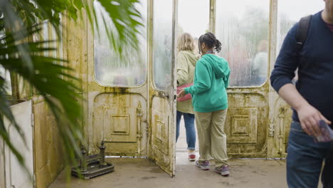 vintage greenhouse with people