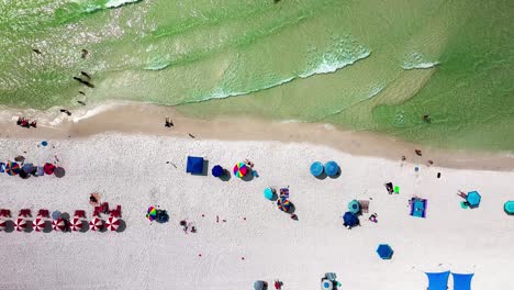 Destin-Florida-slowly-trucking-left-straight-down-aerial-drone-shot-of-the-white-sand-beach-and-emerald-green-water-of-the-Gulf-of-Mexico