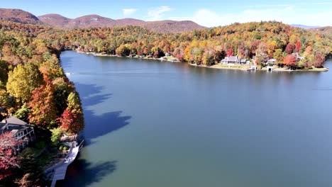 aerial push over treetops in fall, lake toxaway nc, north carolina