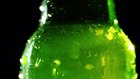 bottle of cold soft drink condensate drops on glass 4k video