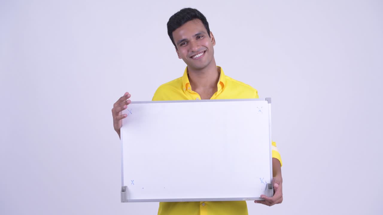 Young handsome Indian businessman with whiteboard