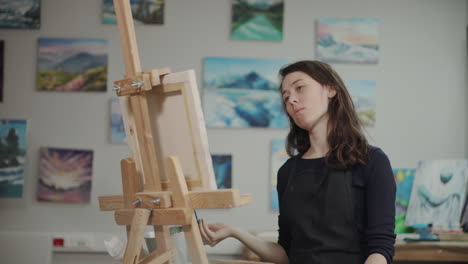 woman painting in an art studio