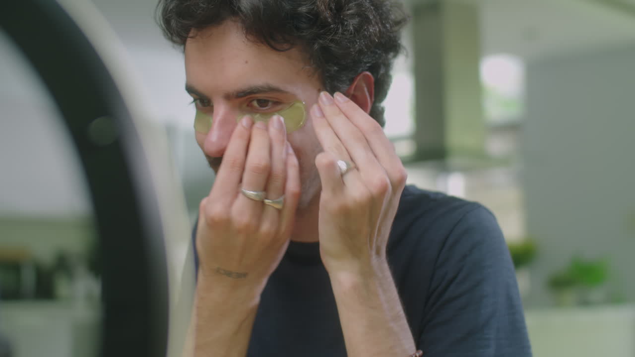 Male Beauty Blogger Explaining How to Use Eye Patches