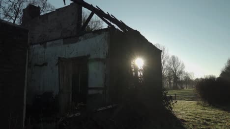 burnt-down house in rural landscape