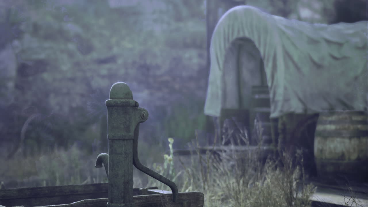 Old water pump near covered wagon in a quiet rural setting at dusk