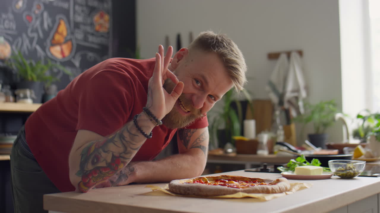 Chef Smelling Pizza and Showing OK Gesture