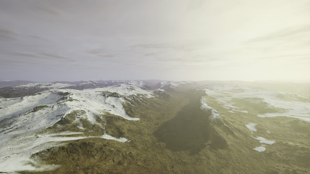 Snowy mountains under soft sunlight during early morning hours in winter