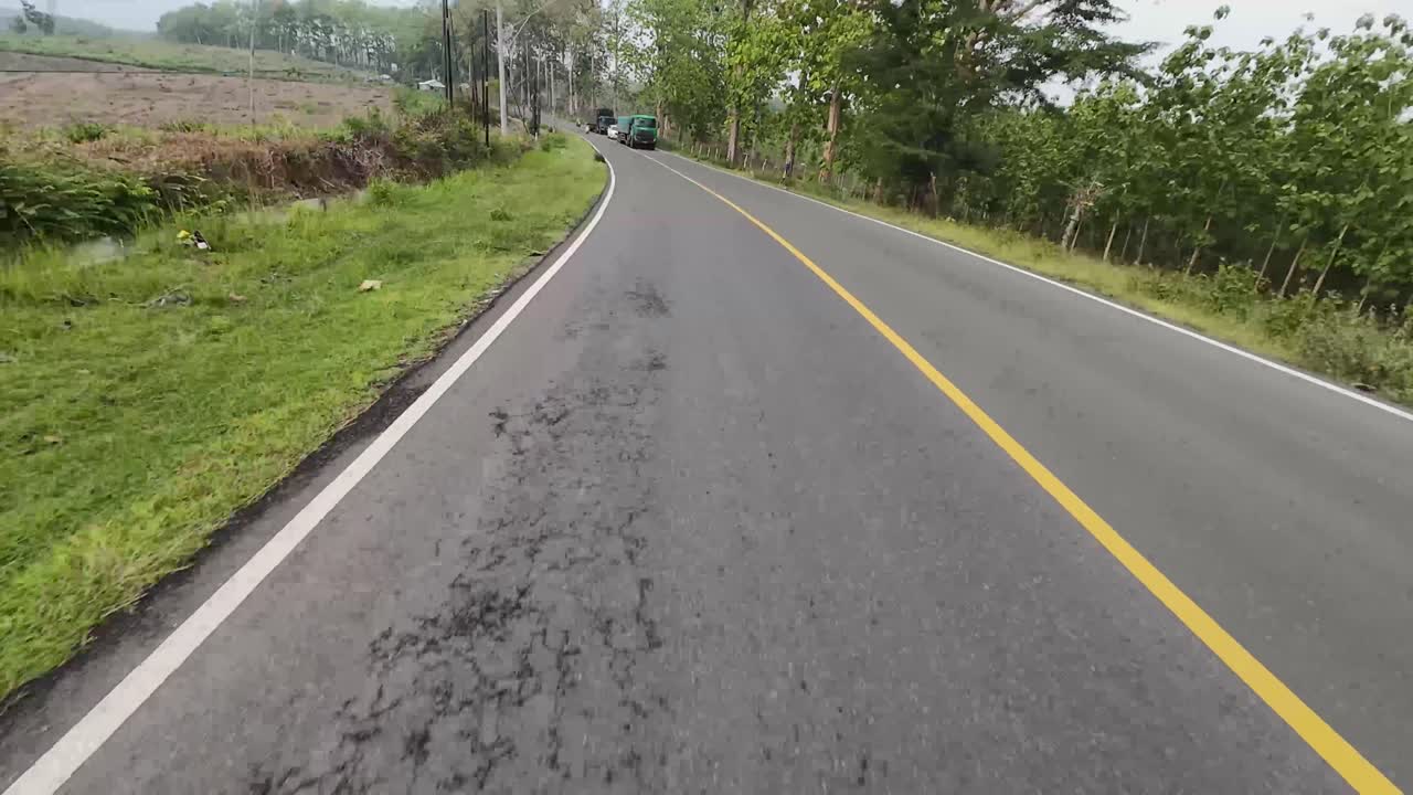Street scenery through forest in the district of Blora, Indonesia