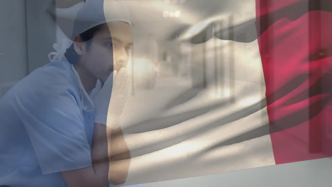 프랑스 국기 의 디지털 구성 병원 에서 스트레스 를 받은 백인 남성 외과 의사 에 대항 하여 흔들고 있다